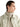Lemaire chunky ribbed merino turtleneck in Beige/Oat, styled under a cream cotton jacket — side profile.