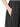 Close-up of the gathered waistband and side pocket on the black skirt