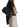 Model carrying The Row Astra black leather bowling bag over the shoulder