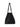 Model carrying The Row Park Tote black leather bag by the handles