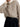 Beige chunky-knit crew-neck jumper, front view with a relaxed oversized fit — MEA345600 at MINOX boutique, Oxford