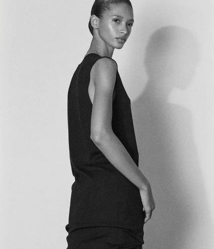 The Row autumn study — black high-collar top in three angles above a black sleeveless knit dress, The Row at MINOX boutique, Oxford